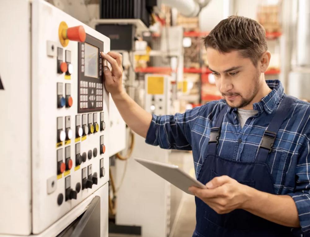 Man looking at manual